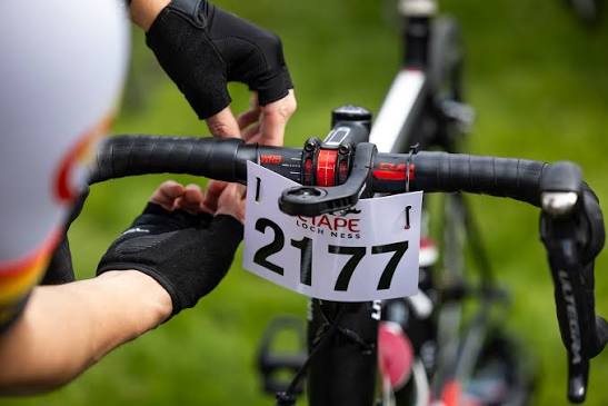 Examples of correctly attached race bibs on handlebars
